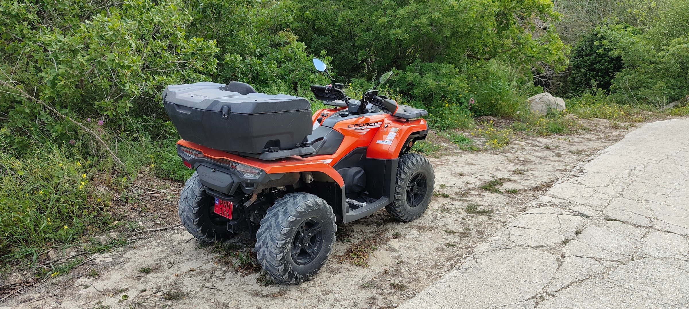 CFORCE 520L quad parked on a countryside trail in the Cyprus greenery